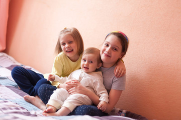 Portrait of three little sisters