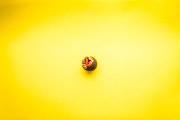 Mangosteen (Garcinia Mangostana) Fruit on a Yellow Background