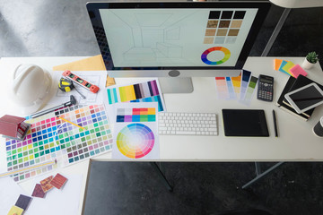 Engineers and creative artists work on table, work, consult, advise on choosing colors and materials, measuring size, choosing cool colors, soft tones, beautiful tones.