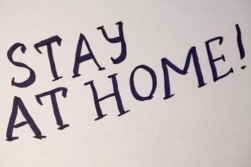 Written at paper phrase stay at home. Coronovirus COVID-19 concept. Coronavirus Pandemic Protection Concept. Stop virus! Quarantine at home.