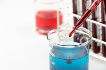 Methylene blue test liquid with blood sample for test, laboratory sample of blood testing for diagnosis virus infection, the pandemic infectious concept