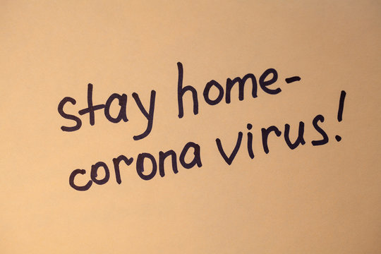 Written at paper phrase stay at home. Coronovirus COVID-19 concept. Coronavirus Pandemic Protection Concept. Stop virus! Quarantine at home.