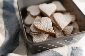 freshly baked heart-shaped cookies prepared on Mother's Day. Sugar, Cinnamon, and lots of love