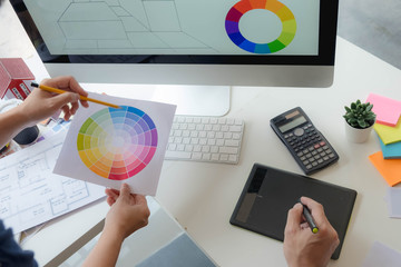 Engineers and creative artists work on table, work, consult, advise on choosing colors and materials, measuring size, choosing cool colors, soft tones, beautiful tones.