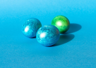 Colorful easter eggs on blue background. Happy Easter composition. Copy space.