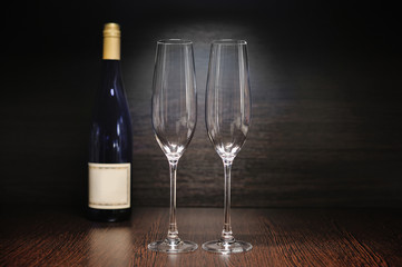Glasses of champagne and bottle for celebration and event.