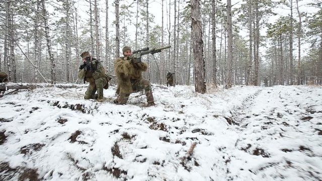 Bullet wound. Soldier was wounded in a firefight. the other drags him into cover