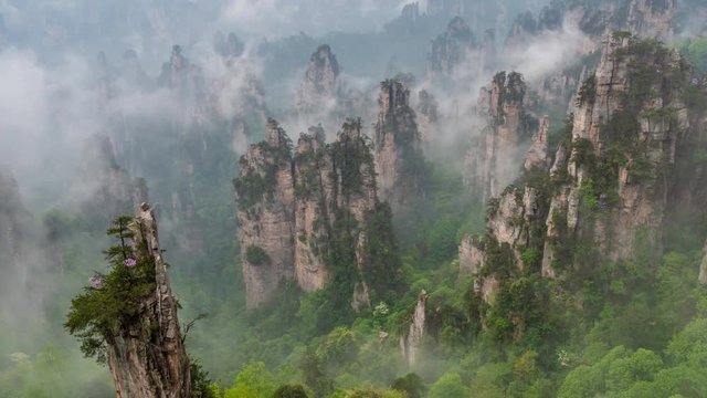 Time lapse of Avatar Floating Mountains in Zhangjiajie Forest Park, China. Clouds and morning fog
