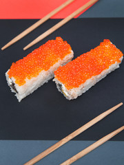 Japanese rolls on grey stone background.