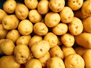 New potatoes in heap at market
