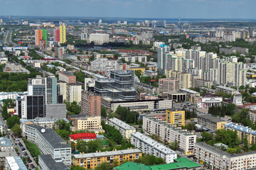 Yekaterinburg, the capital of the Urals, aerial view. Many beautiful residential and commercial buildings, as well as the architectural ensemble of the city, under the summer sun, top view.