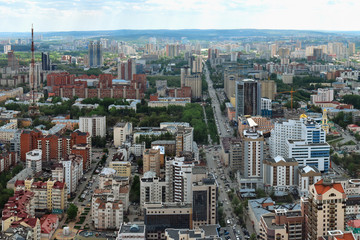 Naklejka premium Yekaterinburg, the capital of the Urals, aerial view. Many beautiful residential and commercial buildings, as well as the architectural ensemble of the city, under the summer sun, top view.