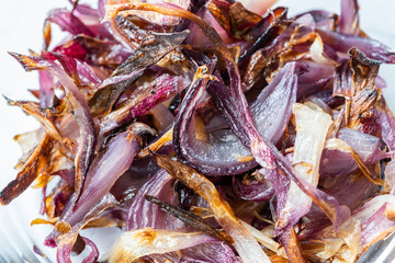 Close up View of Caramelized Onion Slices in Glass Bowl / Macro