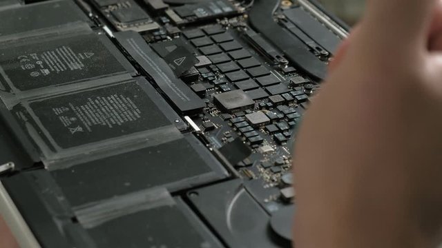 Laptop repair. Microchips close up