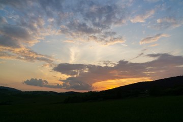 Sunrise or sunset over the hills and meadow. Slovakia