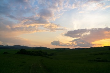 Obraz na płótnie Canvas Sunrise or sunset over the hills and meadow. Slovakia