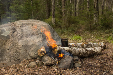 military camp bowler and campfire