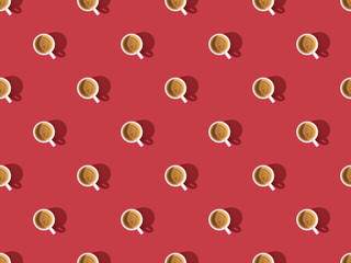 top view of cups of fresh coffee on red, seamless background pattern