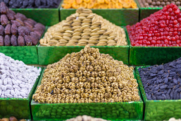 Market stall with various dried fruits and nuts