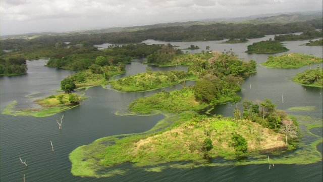 Aerial view of Lake Bayano, small islands with palms and cloud forest in Panama Central America, filmed with Cineflex stabilization camera system
