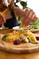 woman cutting vegetables on cutting board