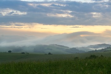 Sunrise or sunset over the hills and meadow. Slovakia