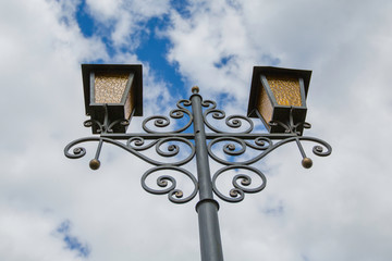 electric lantern on a cloudy sky background