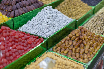 Market stall with various dried fruits and nuts
