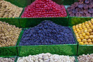 Market stall with various dried fruits and nuts