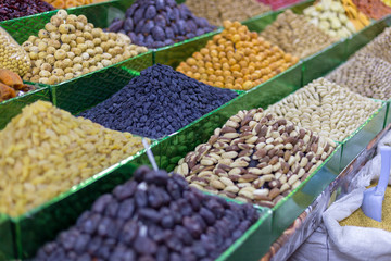 Market stall with various dried fruits and nuts