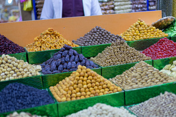 Market stall with various dried fruits and nuts