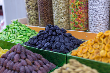 Market stall with various dried fruits and nuts