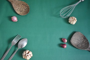 Kitchenware on a green background top view