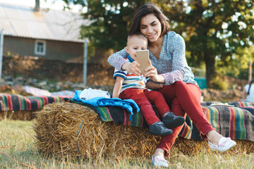mother and son playing with mobile phone