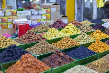 Market stall with various dried fruits and nuts