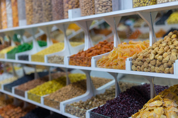 Market stall with various dried fruits and nuts