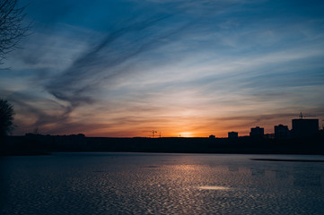 beautiful sunset over the city lake
