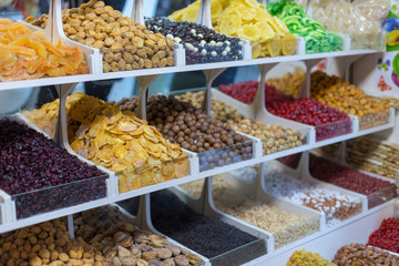 Market stall with various dried fruits and nuts