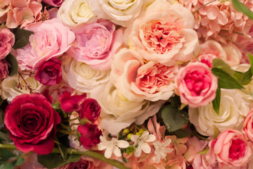 Floral background. A lot of artificial flowers.