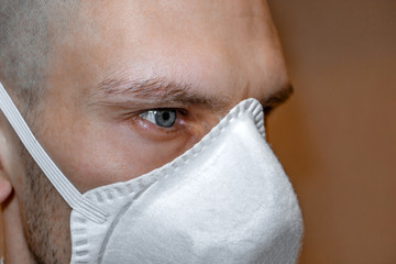 Man in a respirator. Paramedic in a medical mask. Viral pandemic and protection against coronavirus.