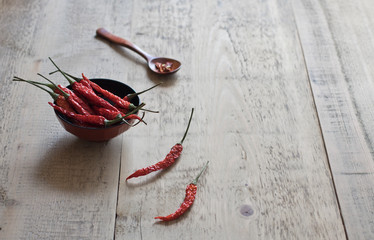 dried chili peppers on a wooden table