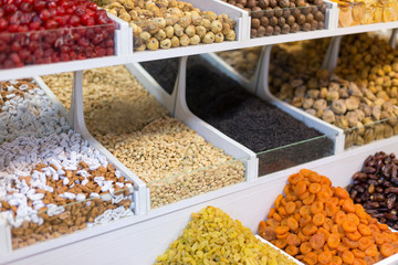 Market stall with various dried fruits and nuts