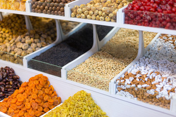 Market stall with various dried fruits and nuts