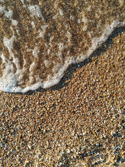 Fototapeta na wymiar Wave an the sand