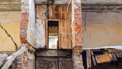 Demolition of the house. Destruction of the walls. Ruins of the building.
