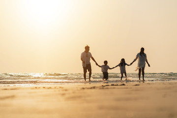 Asian family vacation at the beach with family relationships caused love and understanding to strengthen social immunity.