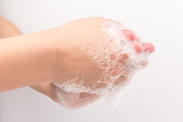 Closeup of children washing hands isolated. Cleanliness and body care concept. Global Handwashing Day Concept/Washing hands with soap
