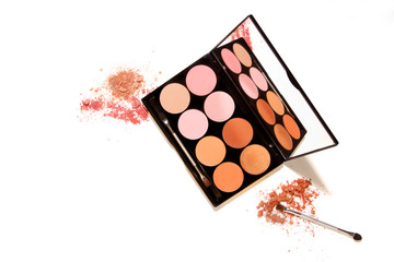 Eyes makeup palette. Sculpting blush, highlighter, bronzer cosmetic products. Black square plastic container with twelve round color samples for luminous look with copy space