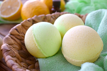 Close up aromatherapy spa concept with bath bombs and fresh lemons. Still life composition for summer resort  cosmetic or dayspa treatment.