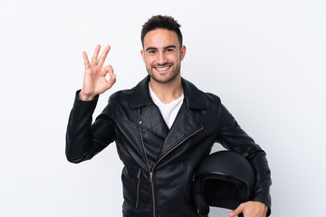 Man with a motorcycle helmet showing ok sign with fingers